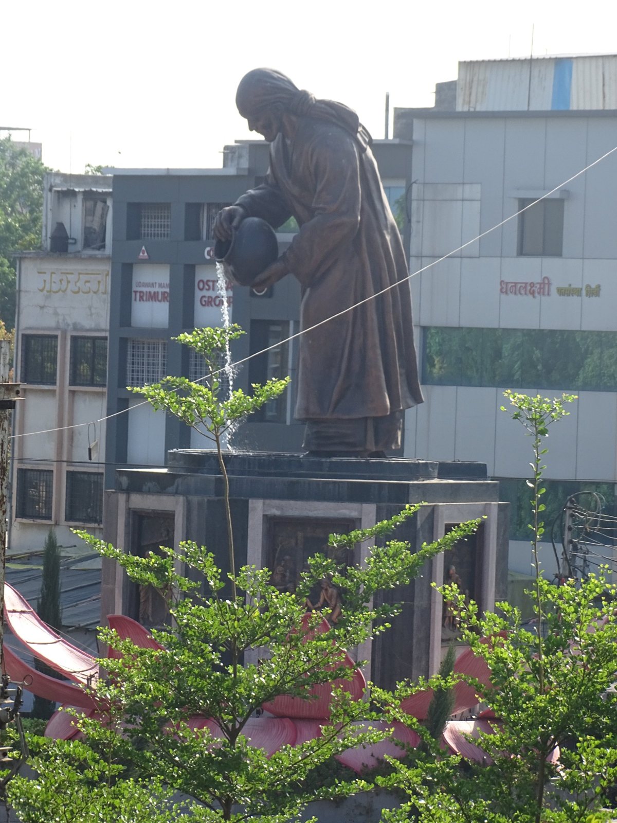 Shri Saibaba statue near the Samadhi Mandir, Shirdi, in the morning, seen from Hotel Saikrupa